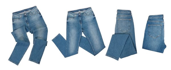 Pairs of jeans on a white background